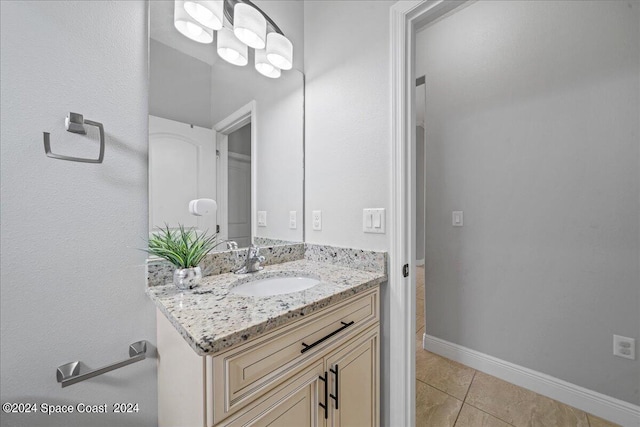 bathroom featuring tile patterned flooring and vanity