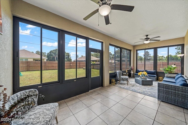 sunroom / solarium with ceiling fan