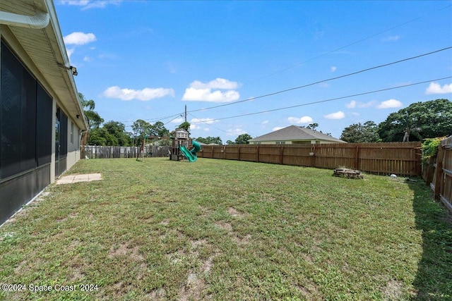 view of yard featuring a playground