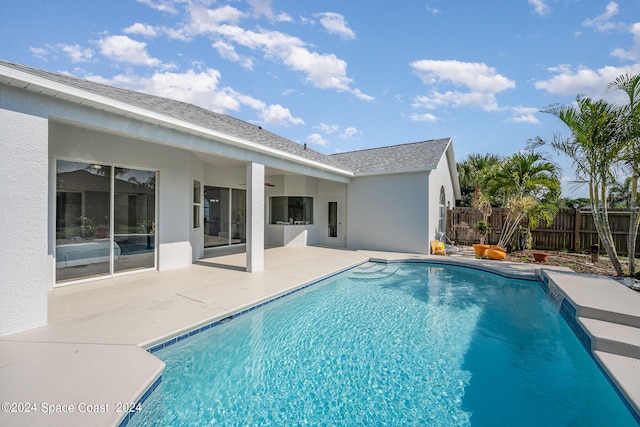 view of swimming pool featuring a patio area