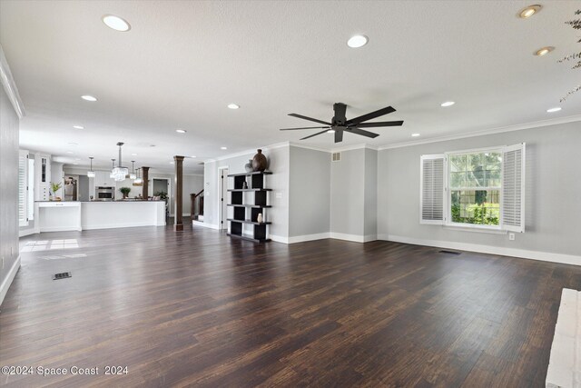 unfurnished living room featuring ceiling fan, crown molding, and dark hardwood / wood-style floors