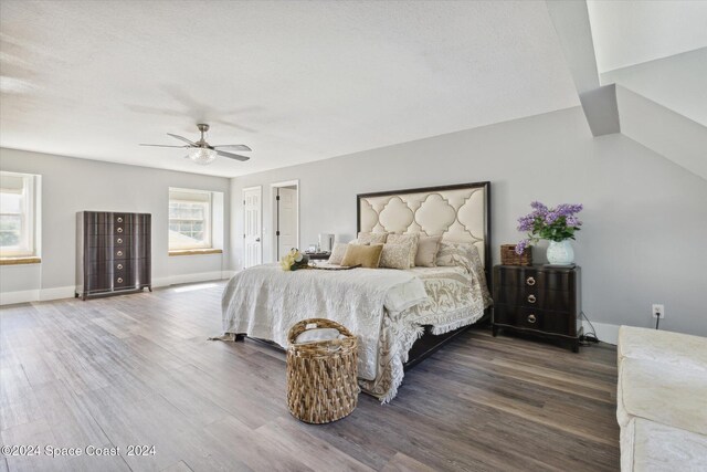 bedroom with ceiling fan and hardwood / wood-style flooring