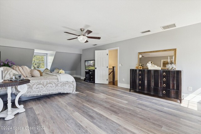 bedroom featuring ceiling fan and hardwood / wood-style floors