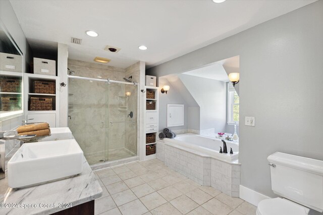 full bathroom featuring toilet, tile patterned floors, separate shower and tub, and vanity