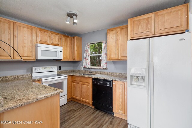 kitchen featuring sink, a textured ceiling, dark hardwood / wood-style floors, white appliances, and light stone countertops