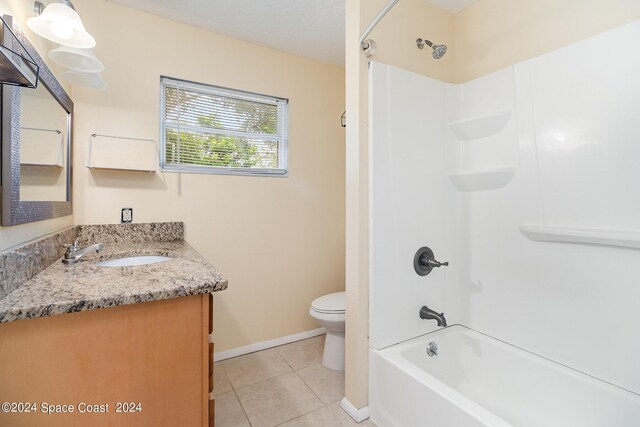 full bathroom featuring tile patterned flooring, vanity, shower / bathing tub combination, and toilet