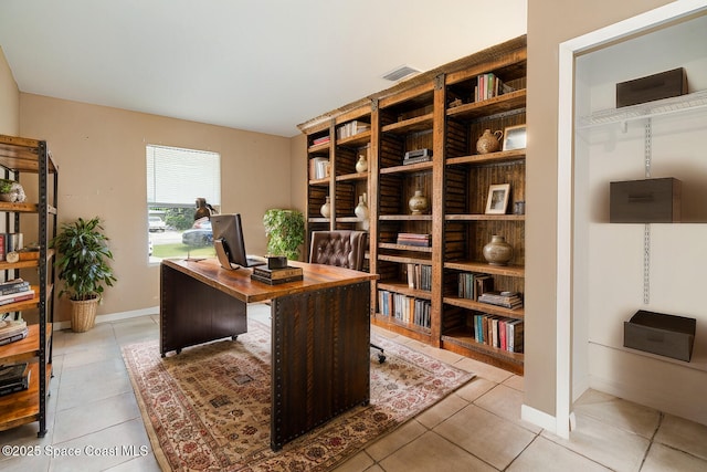 office area with light tile patterned floors