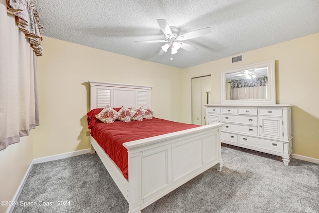 carpeted bedroom with a textured ceiling, a ceiling fan, visible vents, and baseboards