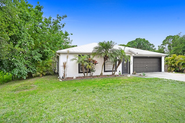 single story home featuring a front lawn and a garage