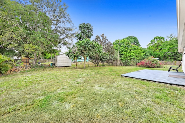 view of yard with a wooden deck