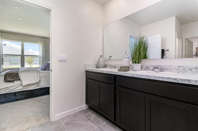 bathroom with double vanity and tile patterned floors