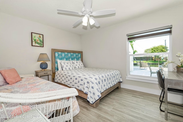 bedroom with ceiling fan and light hardwood / wood-style floors