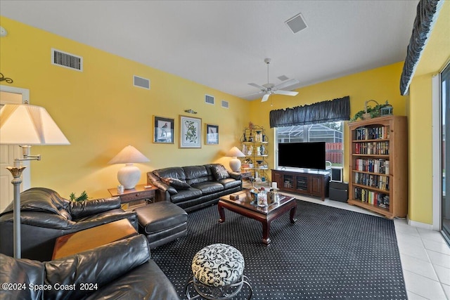 tiled living room featuring ceiling fan