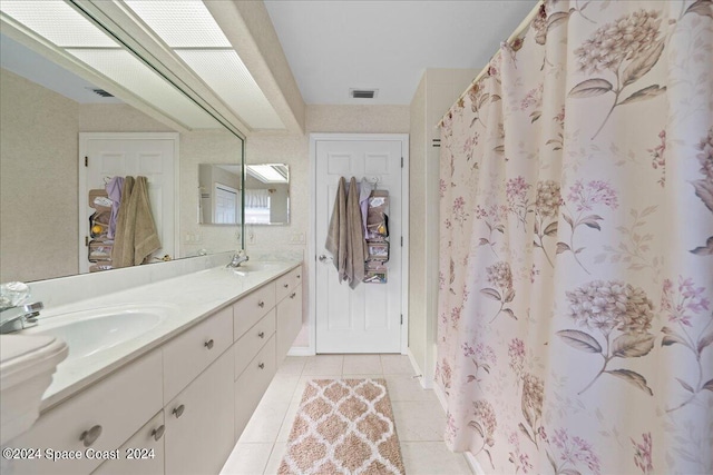 bathroom with tile patterned flooring, vanity, and a shower with shower curtain