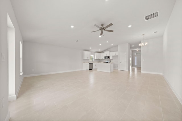 unfurnished living room featuring ceiling fan with notable chandelier, light tile patterned flooring, and lofted ceiling