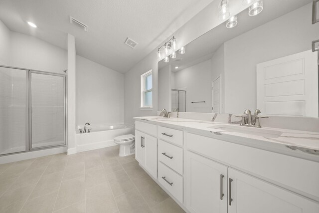 full bathroom with tile patterned floors, vanity, separate shower and tub, and toilet