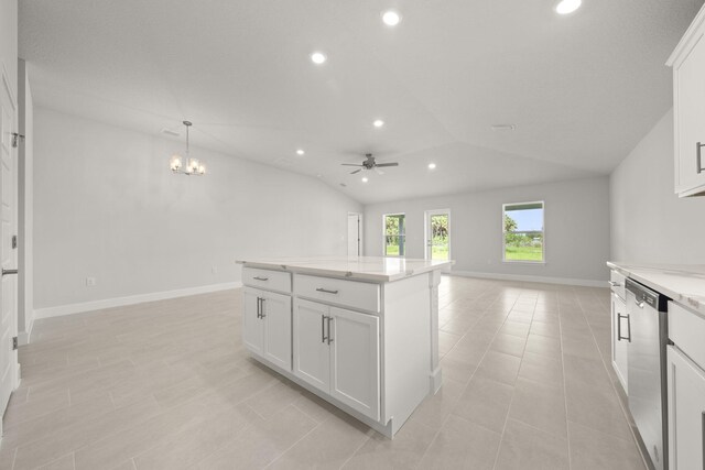 kitchen featuring ceiling fan, pendant lighting, dishwasher, white cabinets, and lofted ceiling