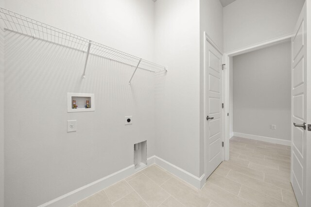 laundry room featuring hookup for an electric dryer and washer hookup