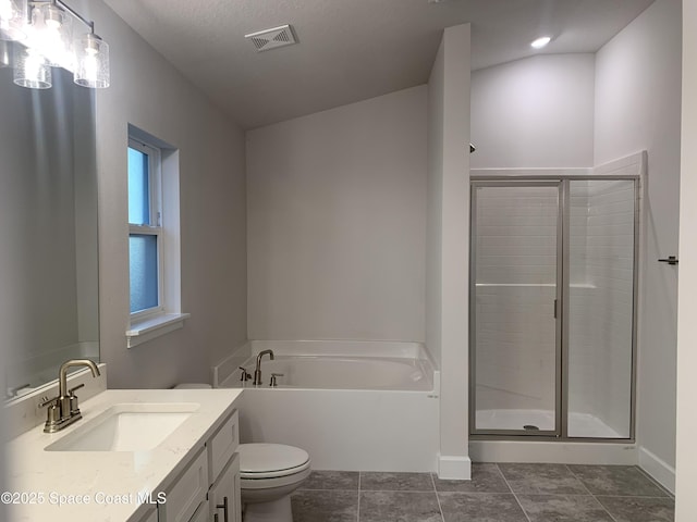 full bathroom with vanity, a textured ceiling, tile patterned floors, shower with separate bathtub, and toilet