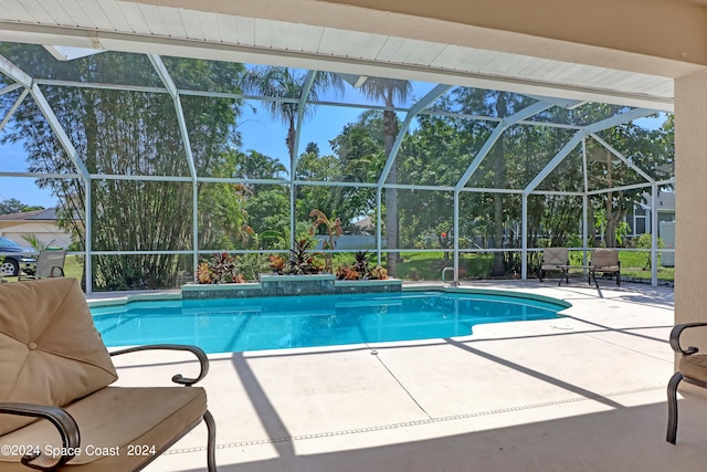 view of swimming pool featuring a patio area and glass enclosure