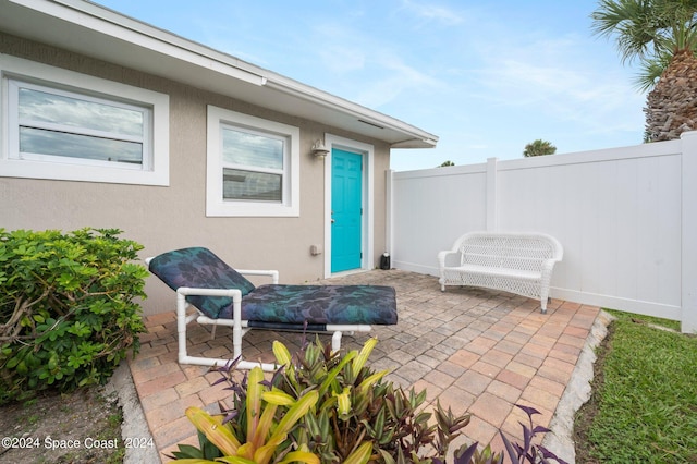 view of patio / terrace featuring fence