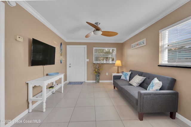 living area featuring light tile patterned floors, plenty of natural light, ornamental molding, and baseboards