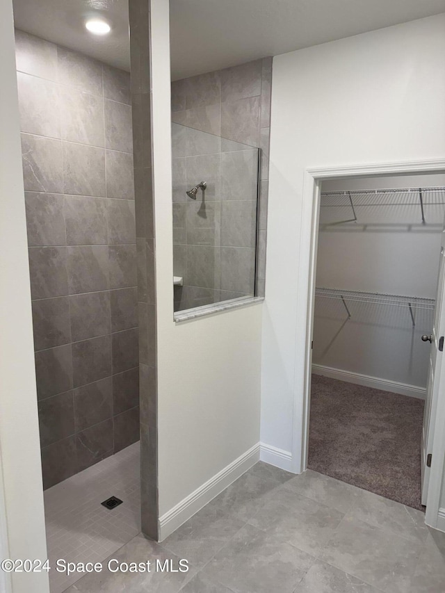 bathroom with a tile shower