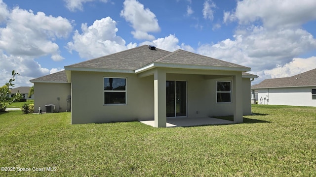 4376 Kelsey Ln, Sebastian, FL 32976 - rear view of house featuring a patio area, roof with shingles, stucco siding, and a lawn