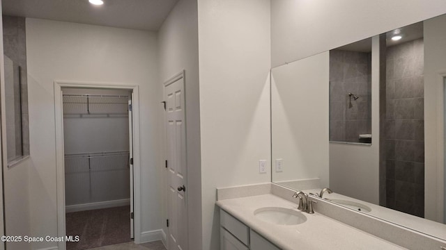 4376 Kelsey Ln, Sebastian, FL 32976 - full bathroom featuring vanity, recessed lighting, a spacious closet, and a tile shower