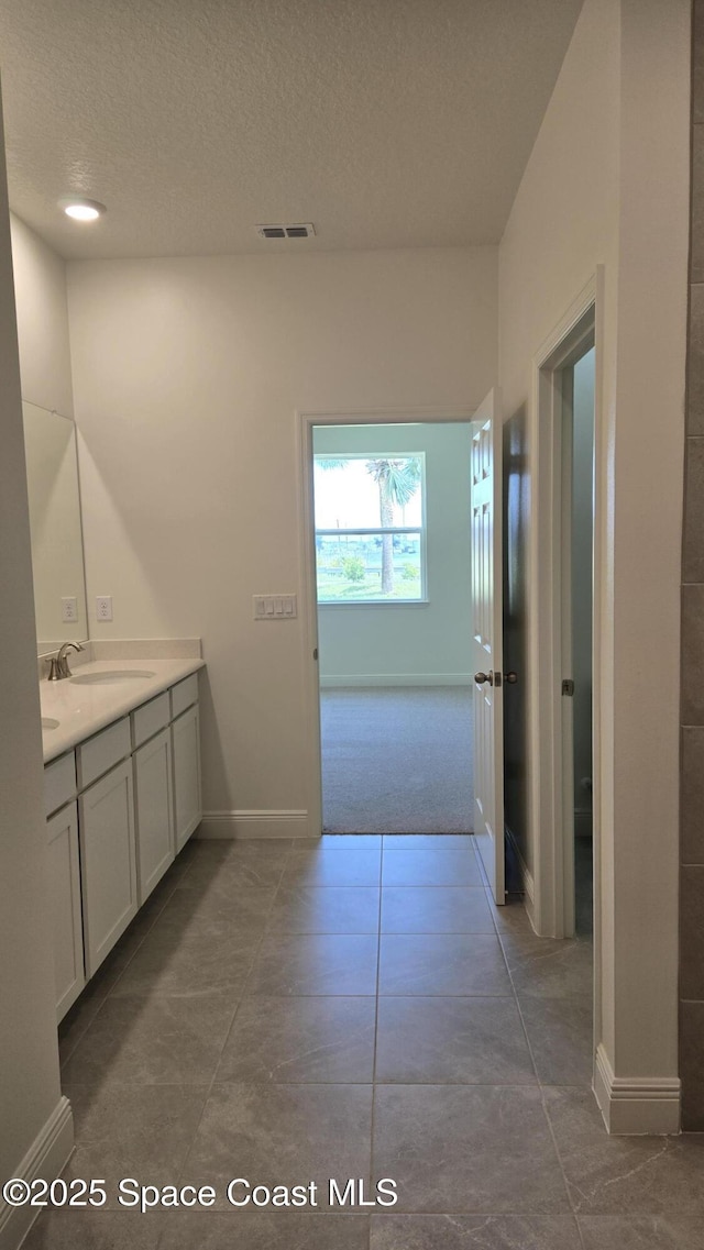 4376 Kelsey Ln, Sebastian, FL 32976 - bathroom with vanity and a textured ceiling
