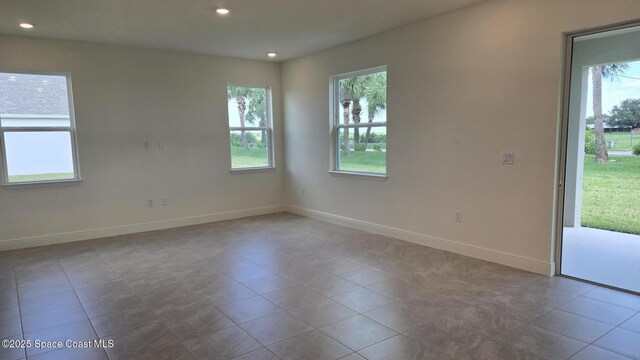 4376 Kelsey Ln, Sebastian, FL 32976 - tiled empty room with baseboards and recessed lighting