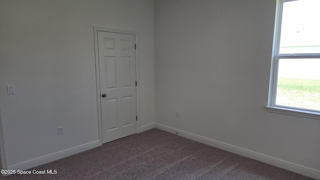 4376 Kelsey Ln, Sebastian, FL 32976 - empty room featuring dark colored carpet and baseboards