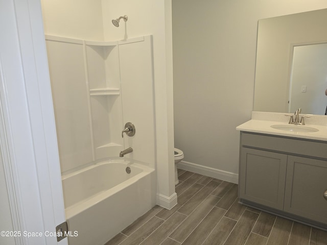 full bathroom with vanity, shower / bathtub combination, and toilet