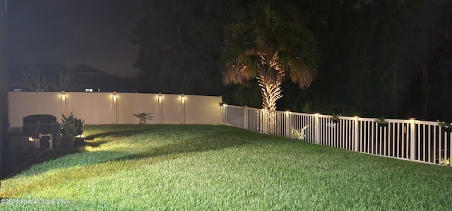 view of yard at twilight