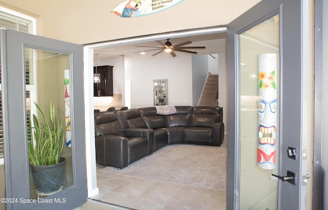 680 Easton Forest Cir SE, Palm Bay, FL 32909 - living area featuring ceiling fan and stairway