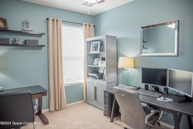 carpeted office with ceiling fan