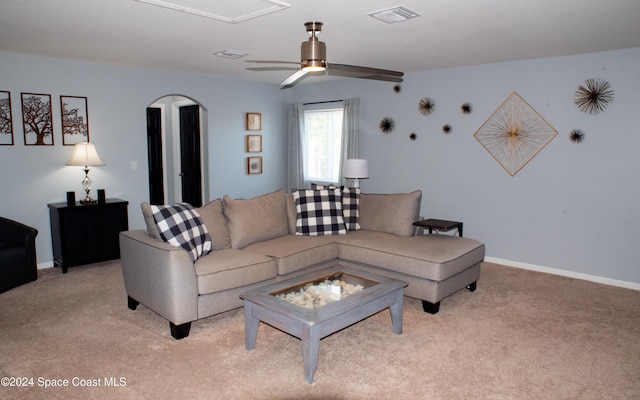 living room featuring light colored carpet and ceiling fan