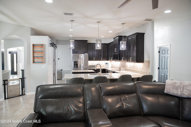 interior space featuring light tile patterned flooring and sink