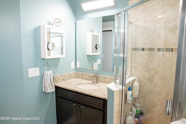 bathroom featuring vanity and walk in shower