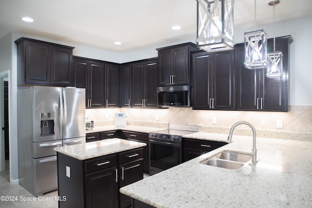 680 Easton Forest Cir SE, Palm Bay, FL 32909 - kitchen with appliances with stainless steel finishes, a sink, light stone counters, a center island, and tasteful backsplash