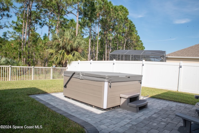 view of yard with a patio area and a hot tub