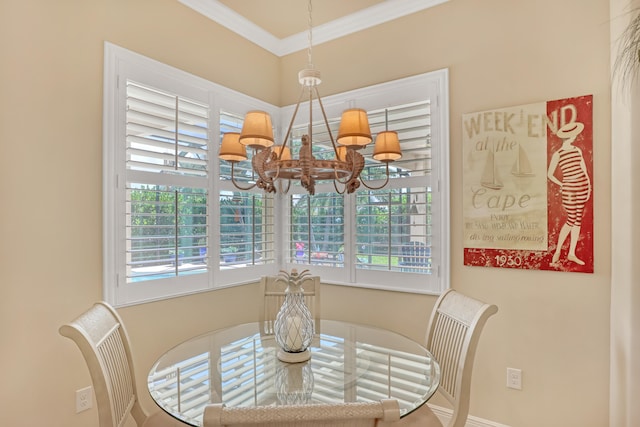 dining room with a notable chandelier, ornamental molding, and a healthy amount of sunlight