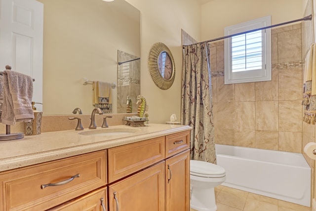 full bathroom featuring tile patterned flooring, vanity, toilet, and shower / bathtub combination with curtain