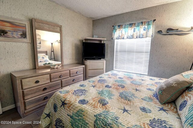 bedroom featuring a textured ceiling