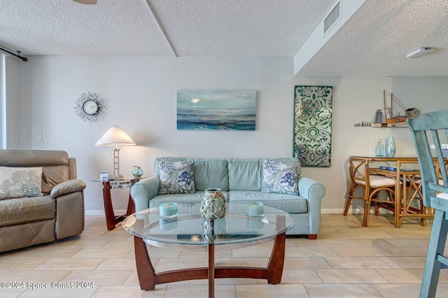 living room with a textured ceiling