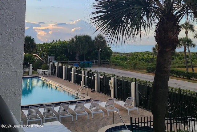 view of swimming pool with a patio