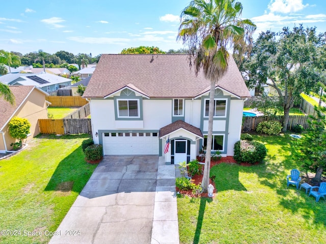 traditional home featuring roof with shingles, driveway, fence, and stucco siding