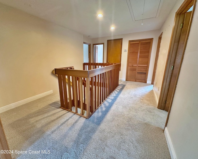 1248 Water Lily Ln, Rockledge, FL 32955 - hall with attic access, carpet, an upstairs landing, and recessed lighting