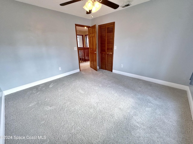 1248 Water Lily Ln, Rockledge, FL 32955 - empty room featuring ceiling fan and carpet