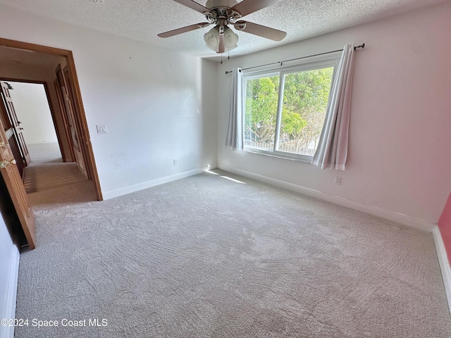 1248 Water Lily Ln, Rockledge, FL 32955 - empty room featuring carpet, a textured ceiling, and ceiling fan